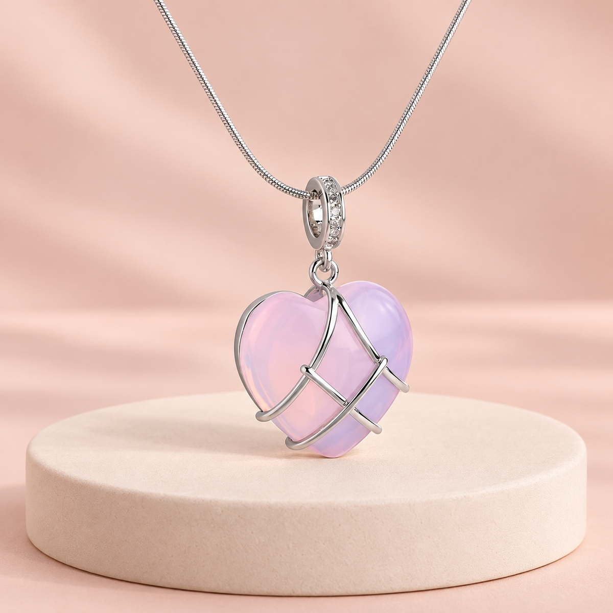 Pink-lilac heart pendant necklace with crossing silver-tone bands