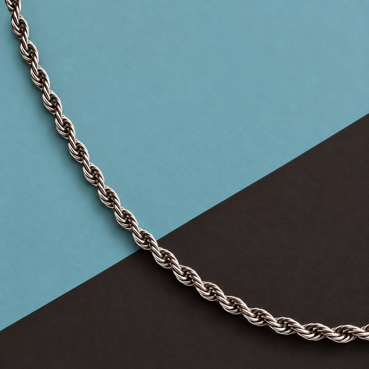 Silver-tone necklace with a twisted rope-chain pattern