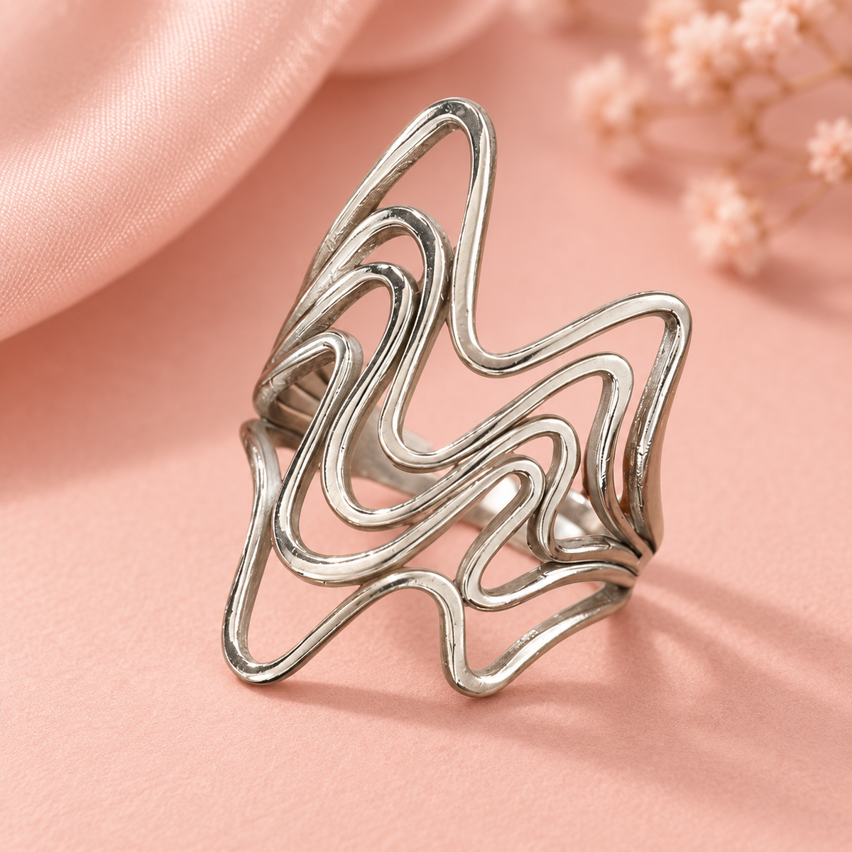Silver-Tone Sculptural Ring Designs open-wave design in close-up