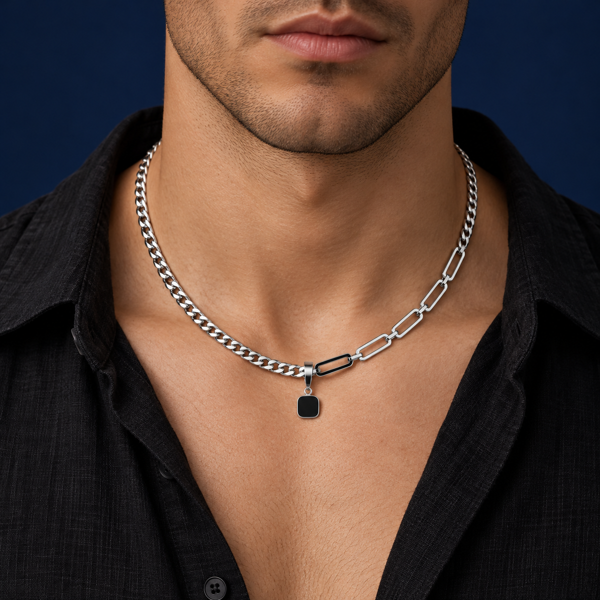 Silver-tone asymmetrical link necklace with a black square pendant styled on a male model