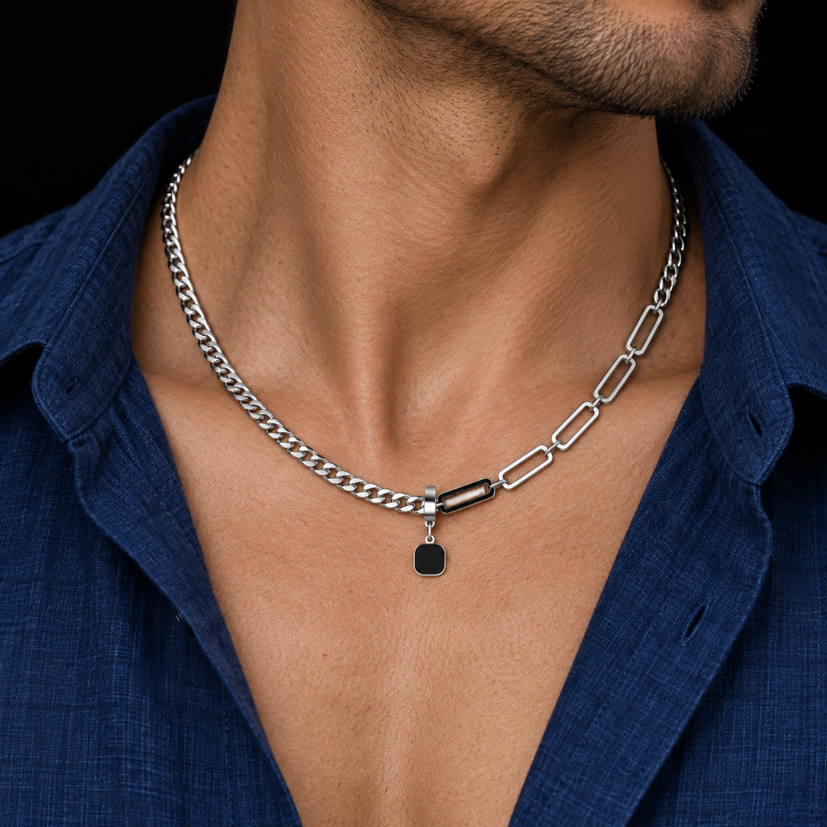 Silver-tone asymmetrical link necklace with a black square pendant styled on a male model