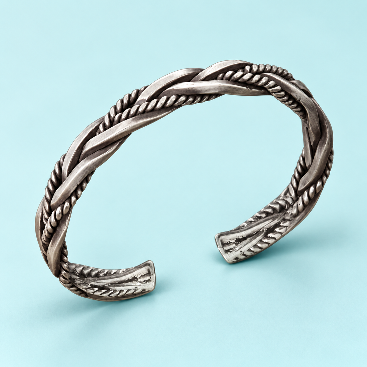 Silver-tone braided open cuff bracelet with rope-textured detailing
