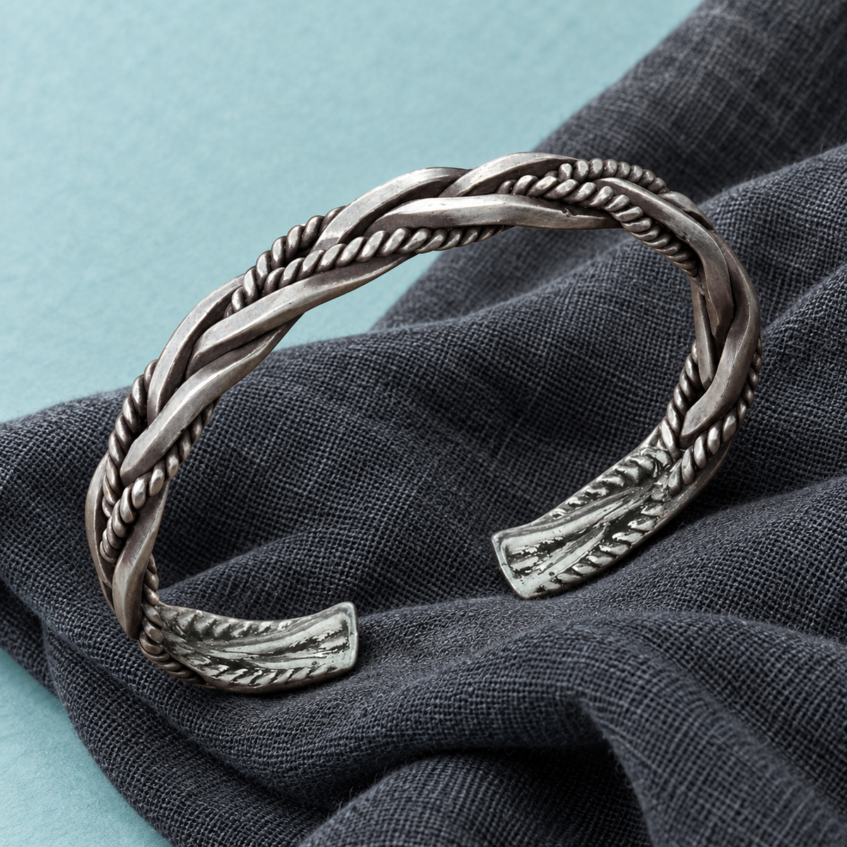 Silver-tone braided open cuff bracelet with rope-textured detailing