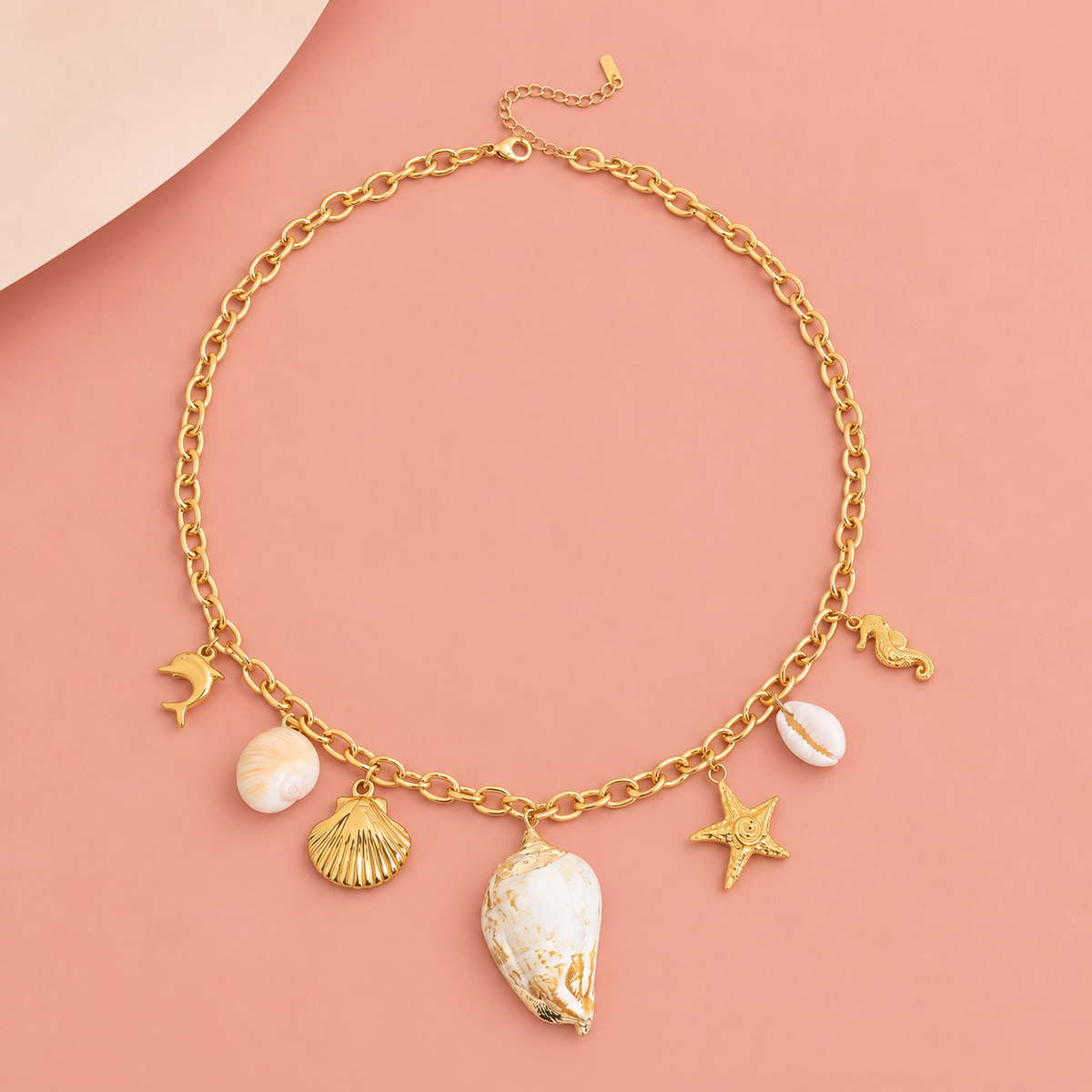 Gold-tone necklace with seven marine-themed charms
