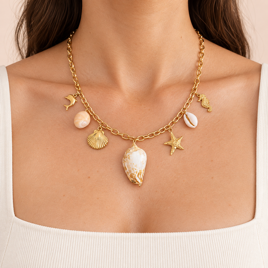 Gold-tone necklace with seven marine-themed charms