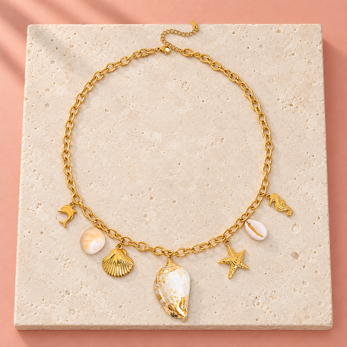Gold-tone necklace with seven marine-themed charms