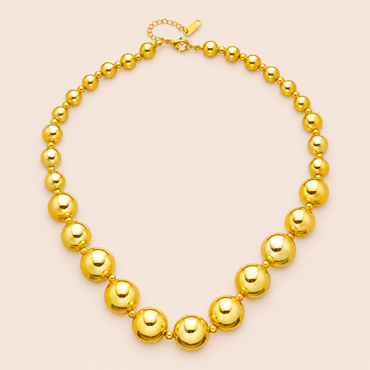 Gold-tone necklace with graduated round beads and small spacers