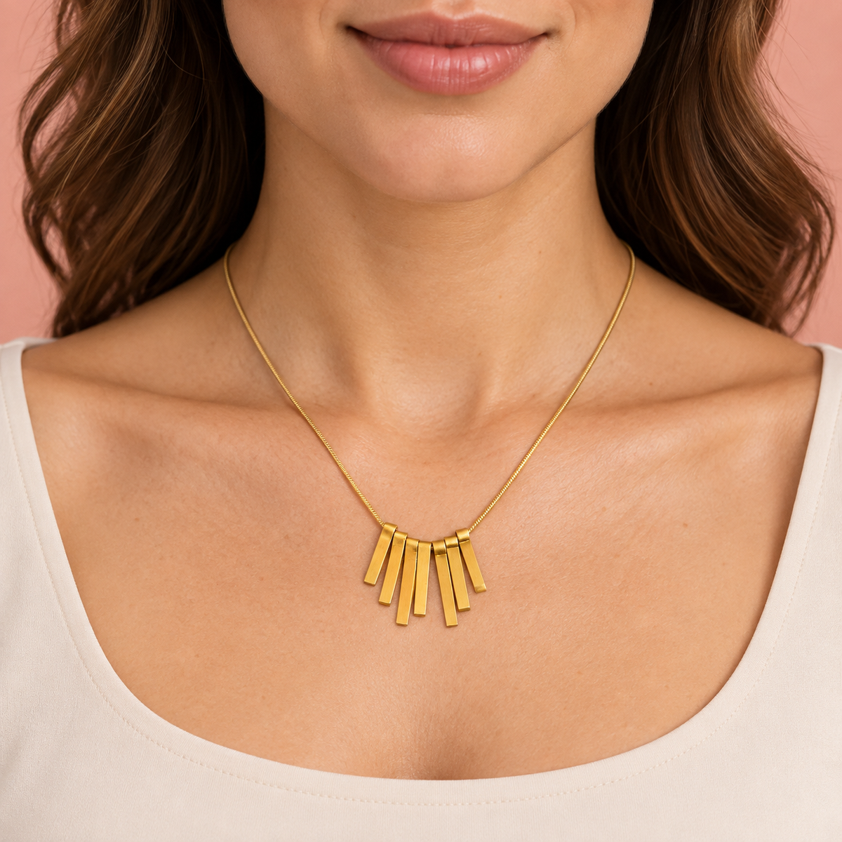 Gold-tone fine-chain necklace with seven graduated rectangular drops