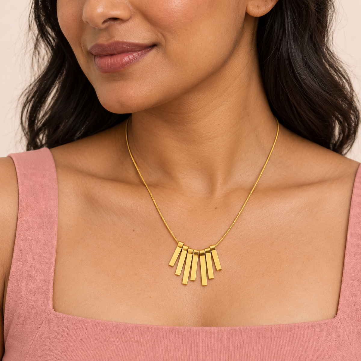 Gold-tone fine-chain necklace with seven graduated rectangular drops