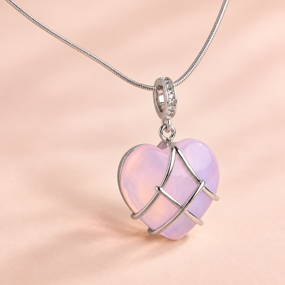 Pink-lilac heart pendant necklace with crossing silver-tone bands