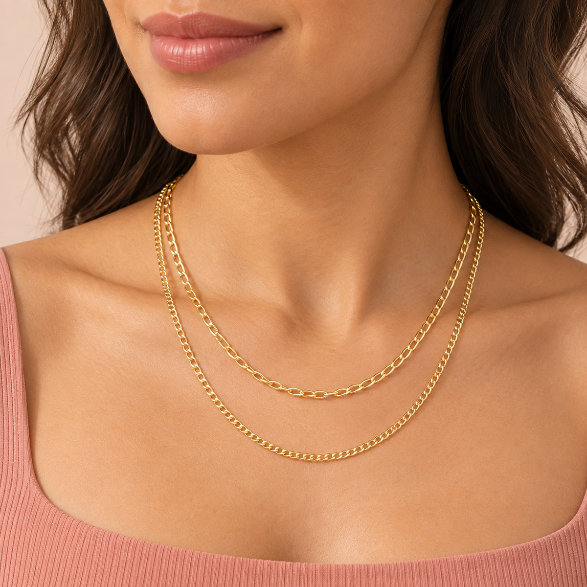 Gold-tone necklace shown with two chain layers of different link sizes
