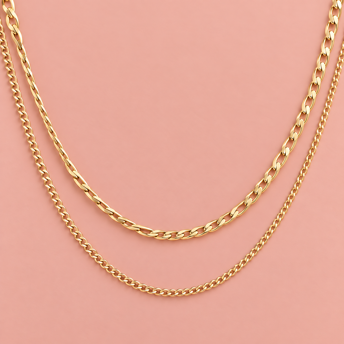 Gold-tone necklace shown with two chain layers of different link sizes