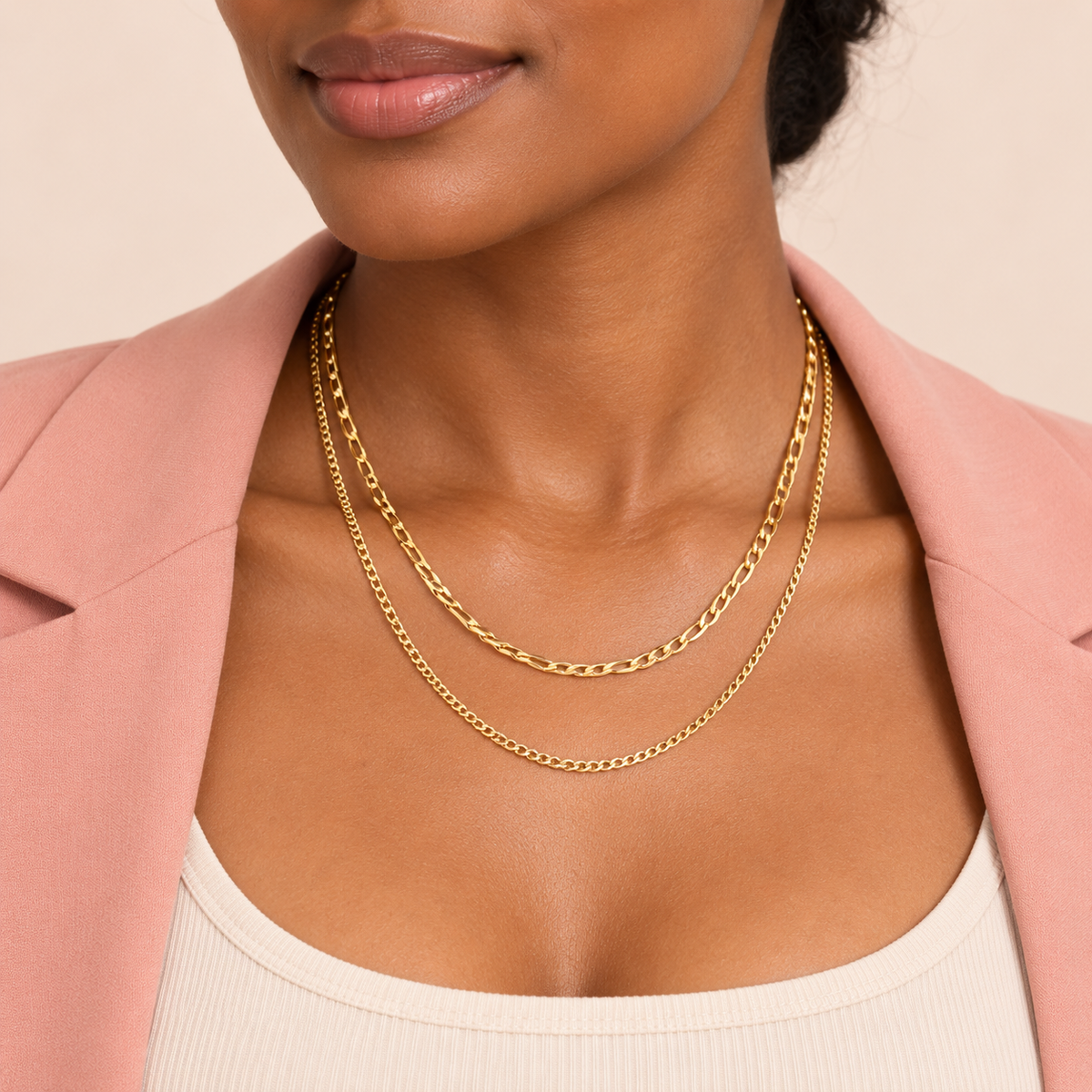 Gold-tone necklace shown with two chain layers of different link sizes