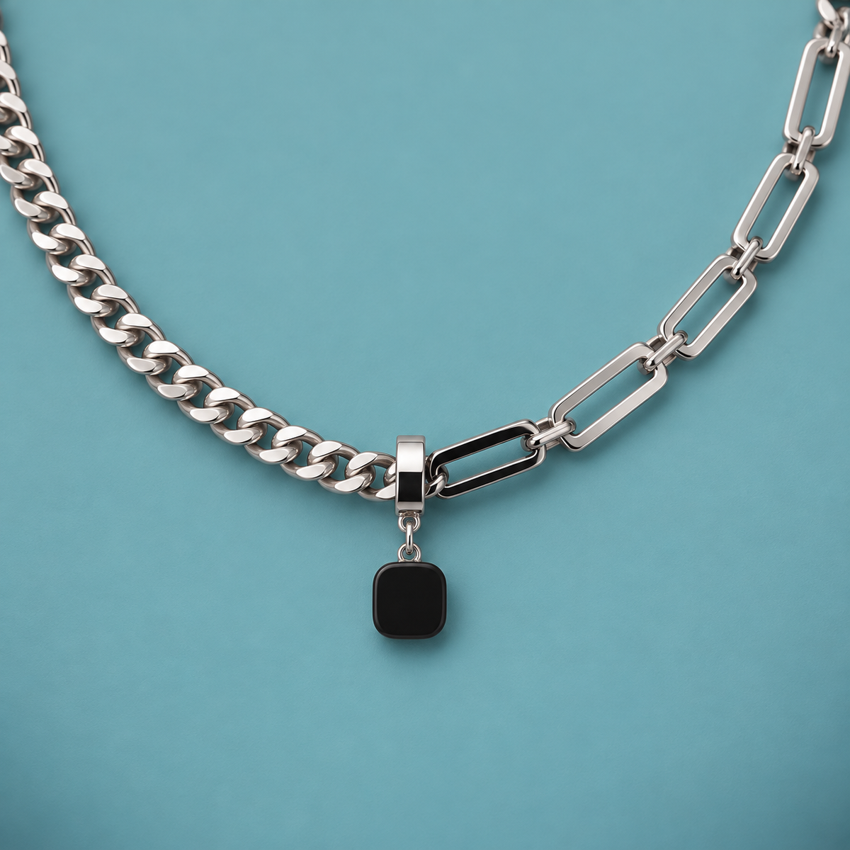 Close-up of the black pendant, bail and contrasting link shapes