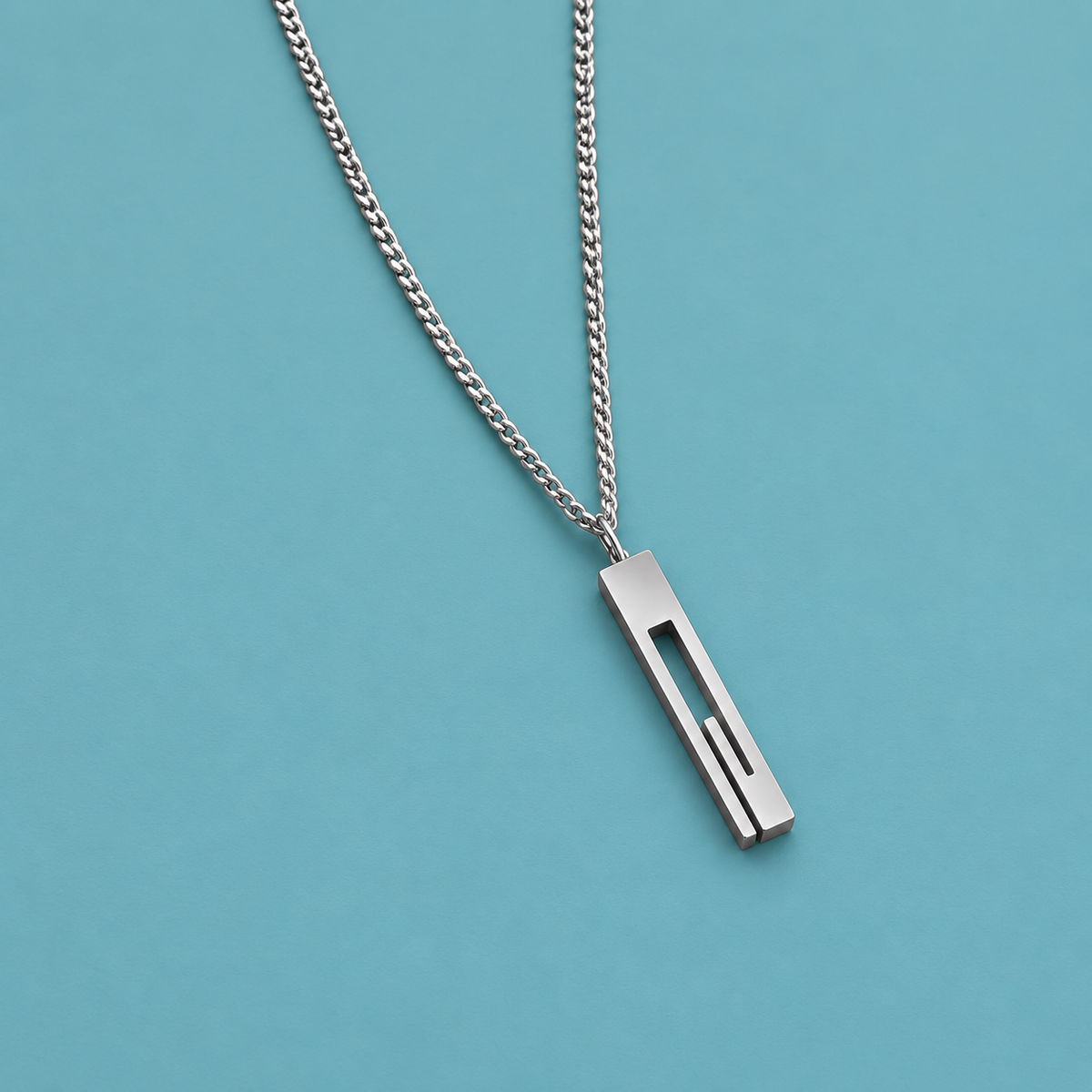 Silver-tone necklace with a long rectangular open-slot pendant