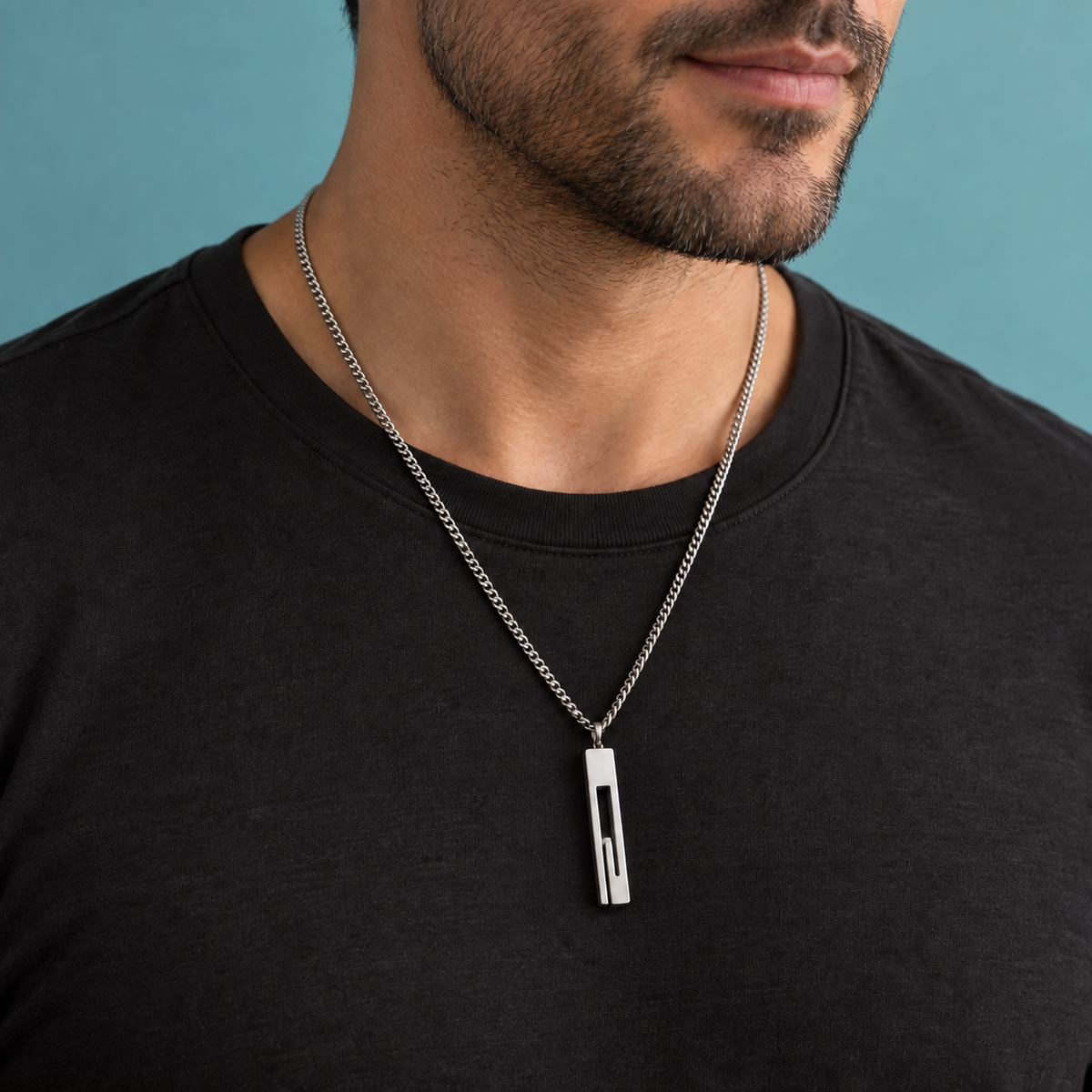 Silver-tone necklace with a long rectangular open-slot pendant