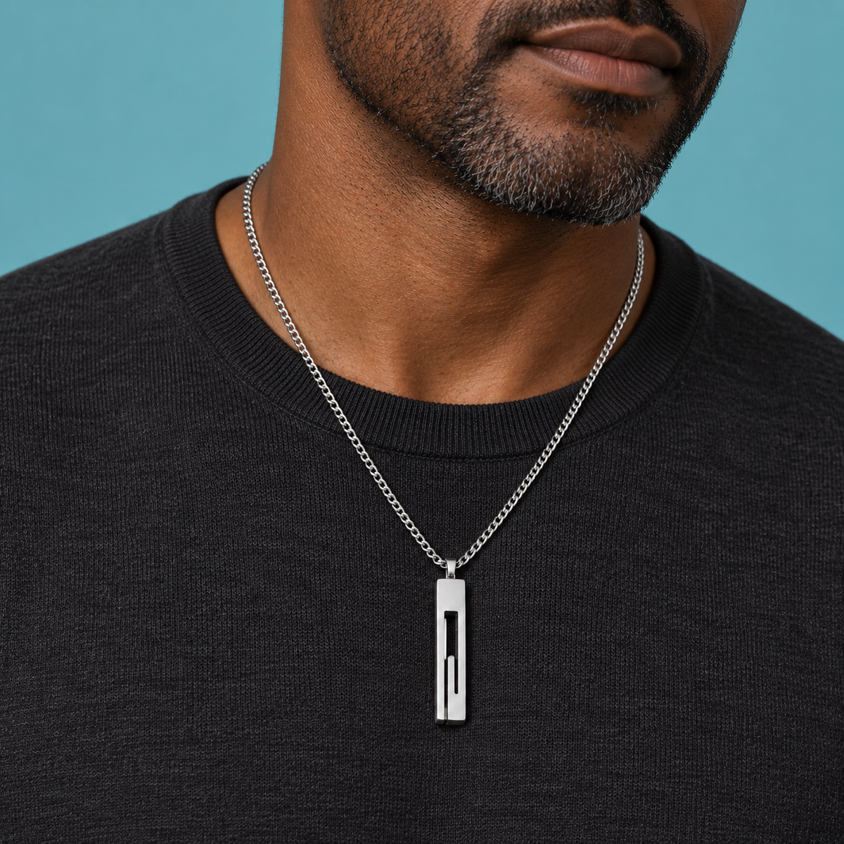 Silver-tone necklace with a long rectangular open-slot pendant