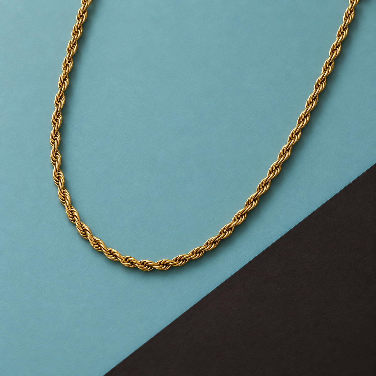 Rope-style necklace arranged diagonally on aqua
