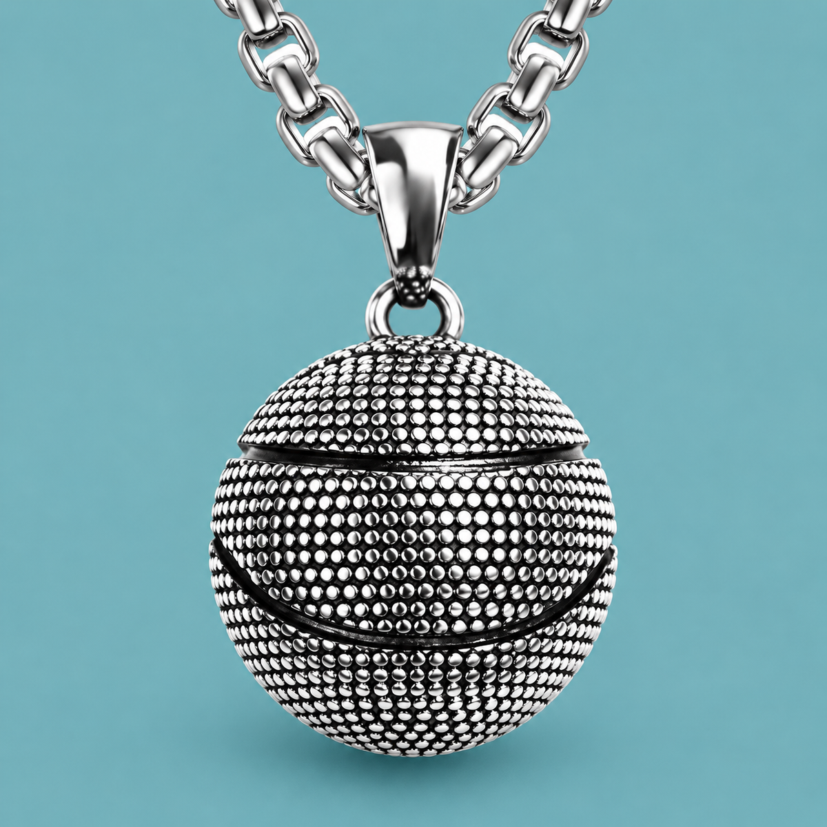 Close-up of the ball pendant's raised texture and curved grooves
