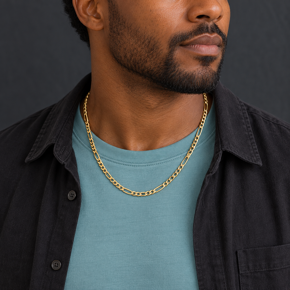 Gold-Tone Figaro Chain Necklace for Men worn over a teal shirt