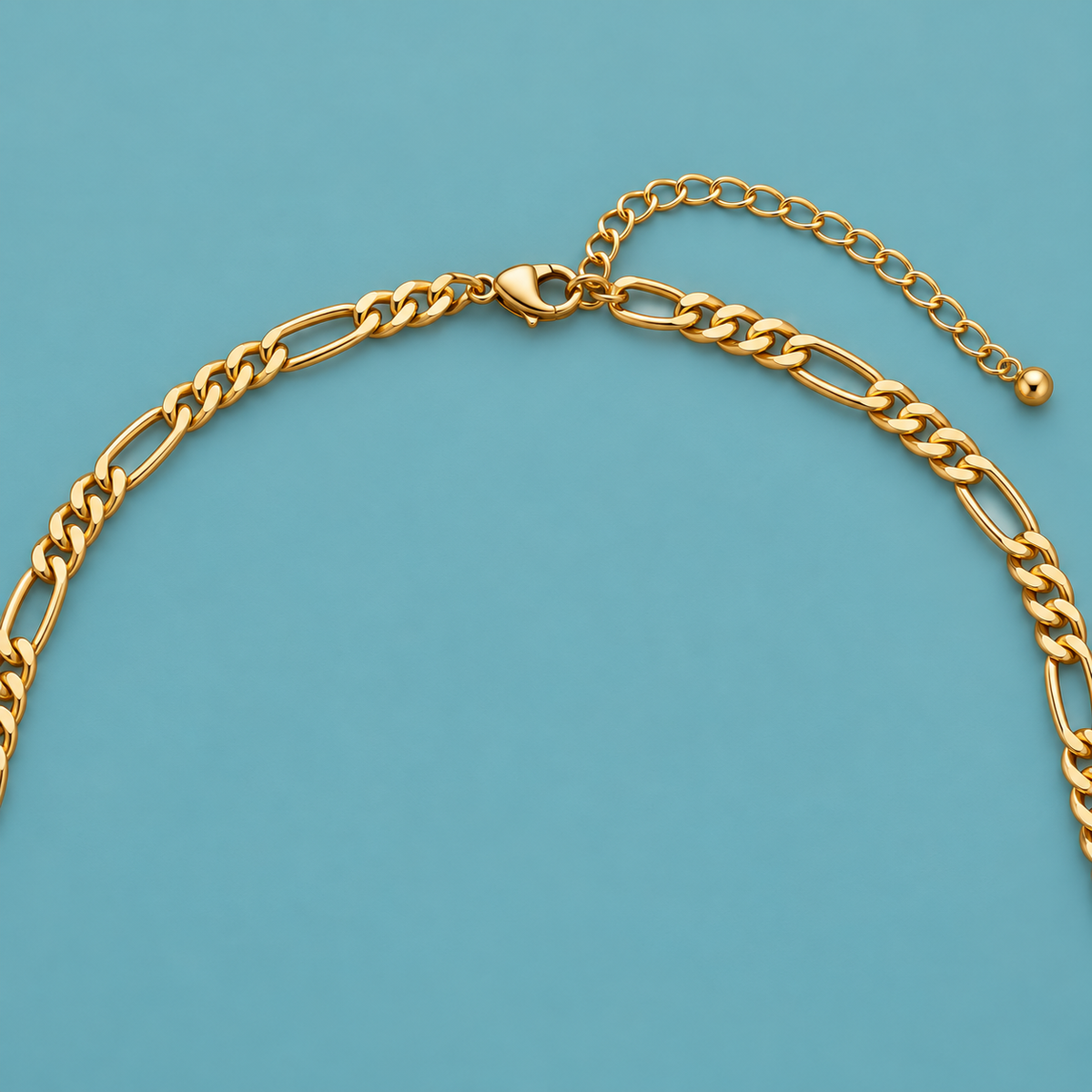Gold-Tone Figaro Chain Necklace for Men clasp and extender detail on a teal background