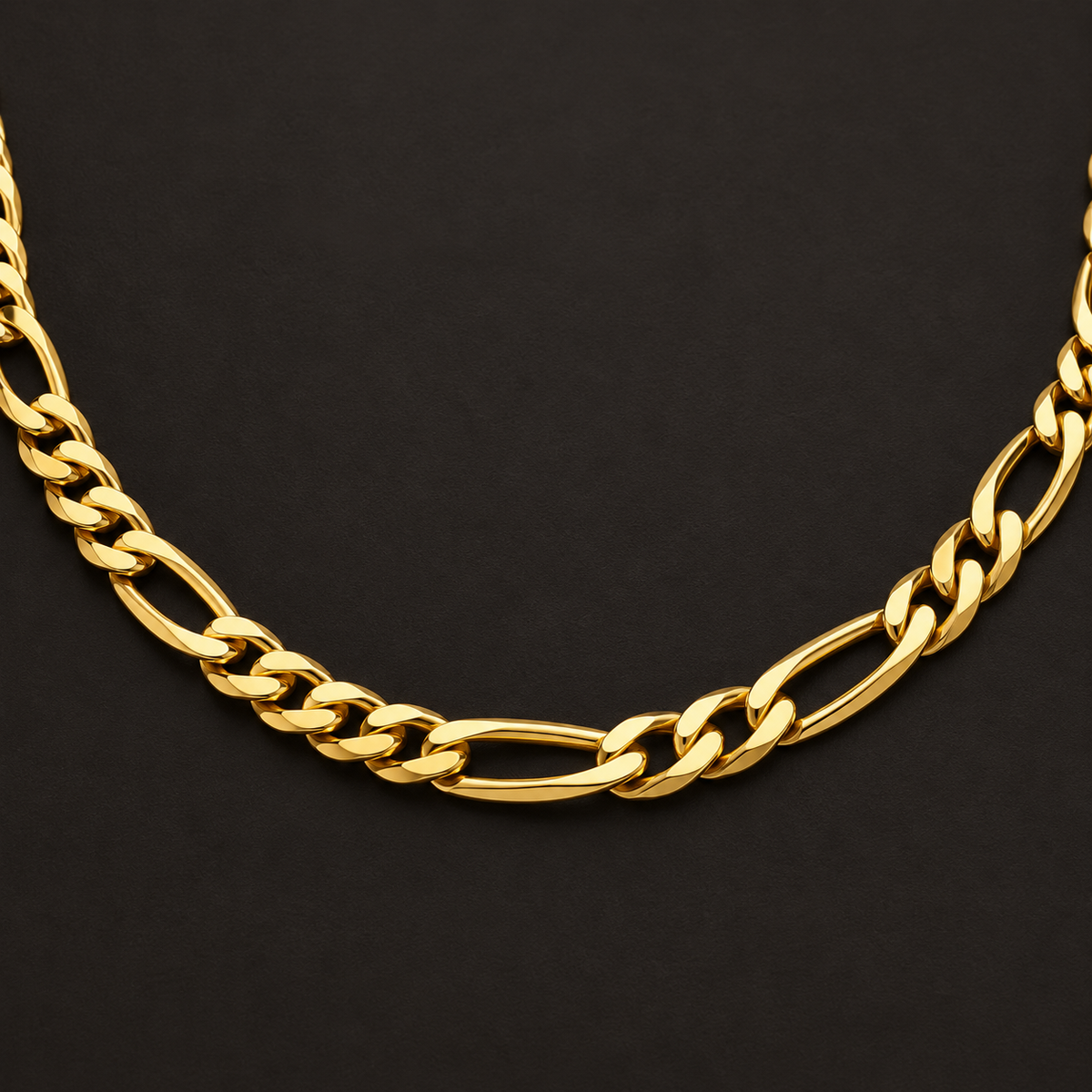 Bold Gold-Tone Figaro Necklace for Men link detail on a dark background