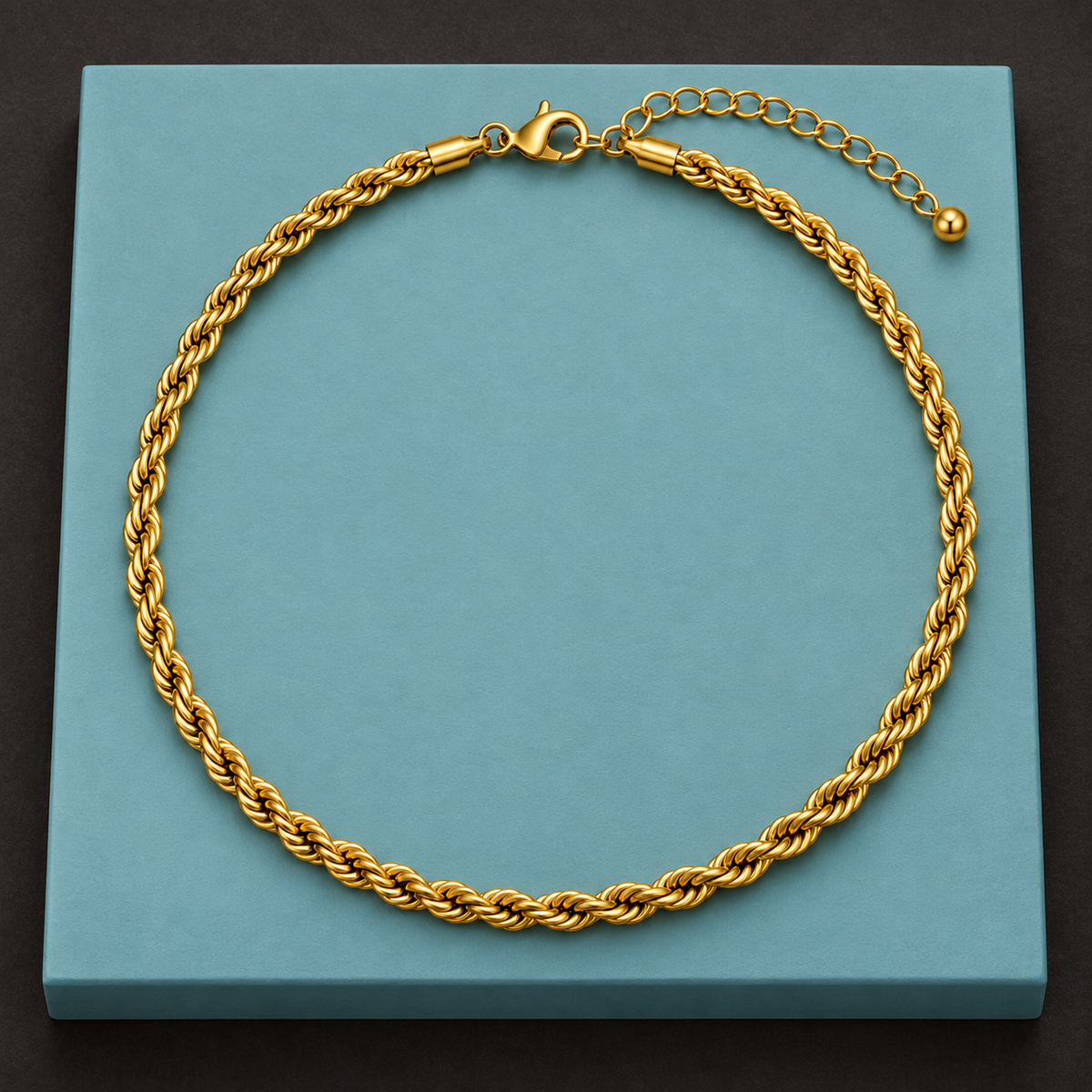 Bold Gold-Tone Rope Necklace for Men on a teal display plinth