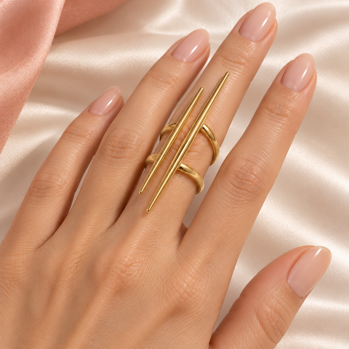 Gold-Tone Double Spike Ring worn on a hand