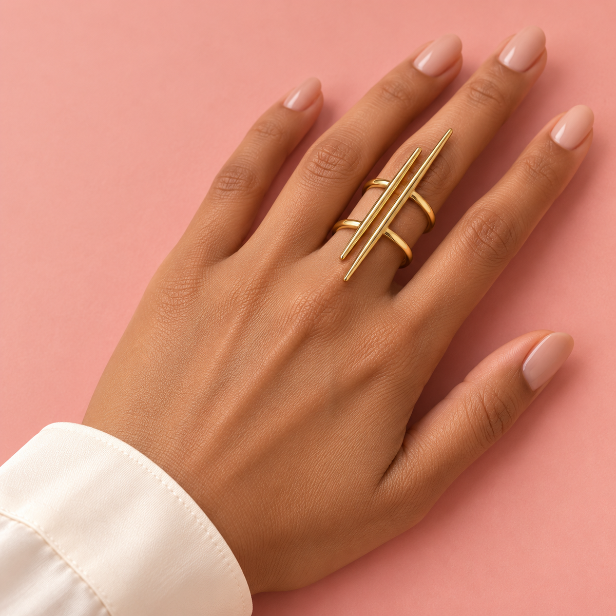 Gold-Tone Double Spike Ring worn on a hand