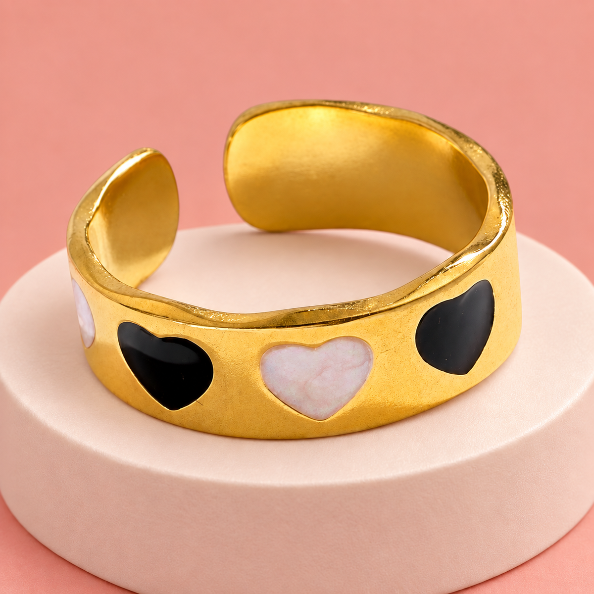 Gold-Tone Heart Cuff Ring for Women on a softly coloured surface
