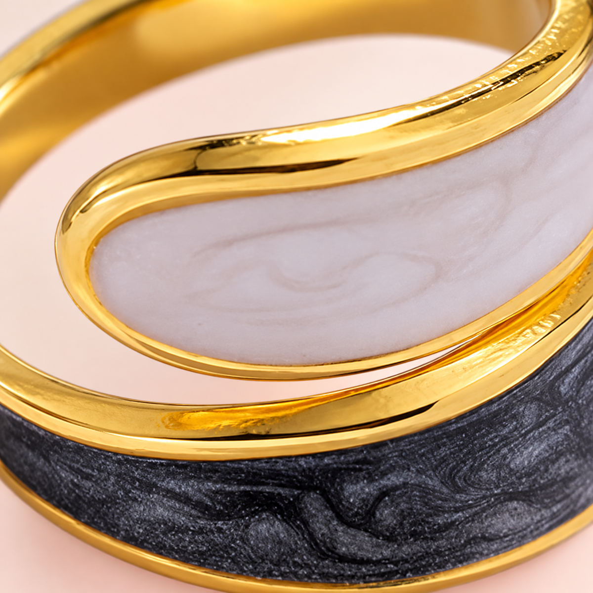 Macro detail of the ring's contrasting pale and dark surfaces