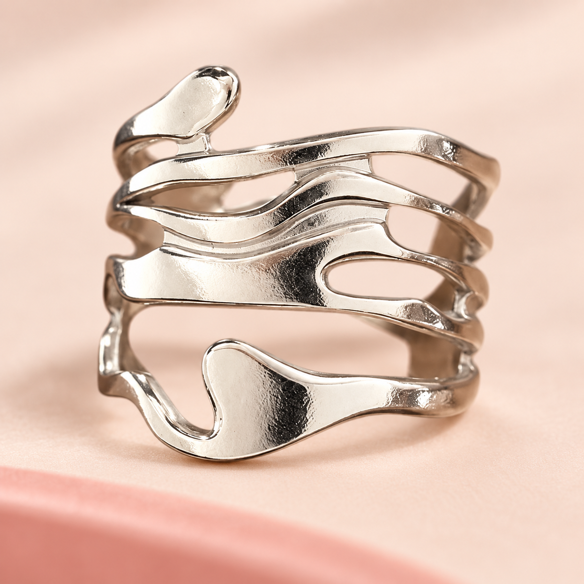 Silver-Tone Sculptural Ring Designs broad cutout design in close-up