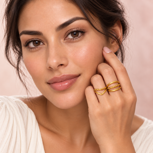 Gold-Tone Layered Ring Designs worn on a hand
