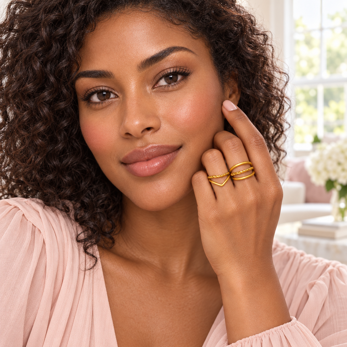 Gold-Tone Layered Ring Designs worn on a hand