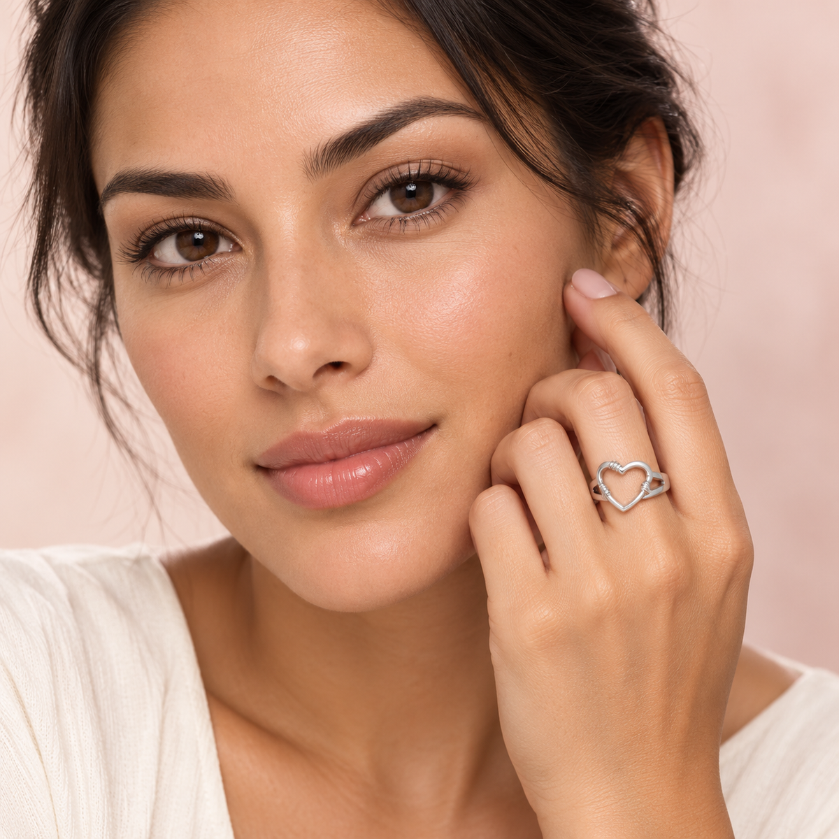 Silver-Tone Open Heart Ring worn on a hand