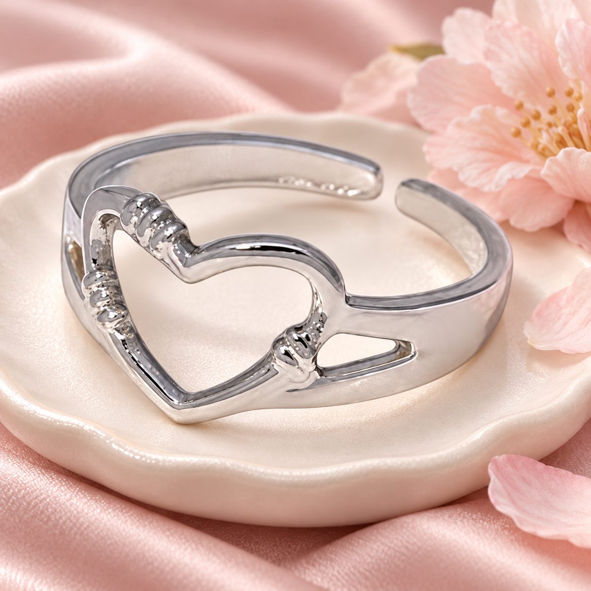 Silver-Tone Open Heart Ring in a styled product photograph