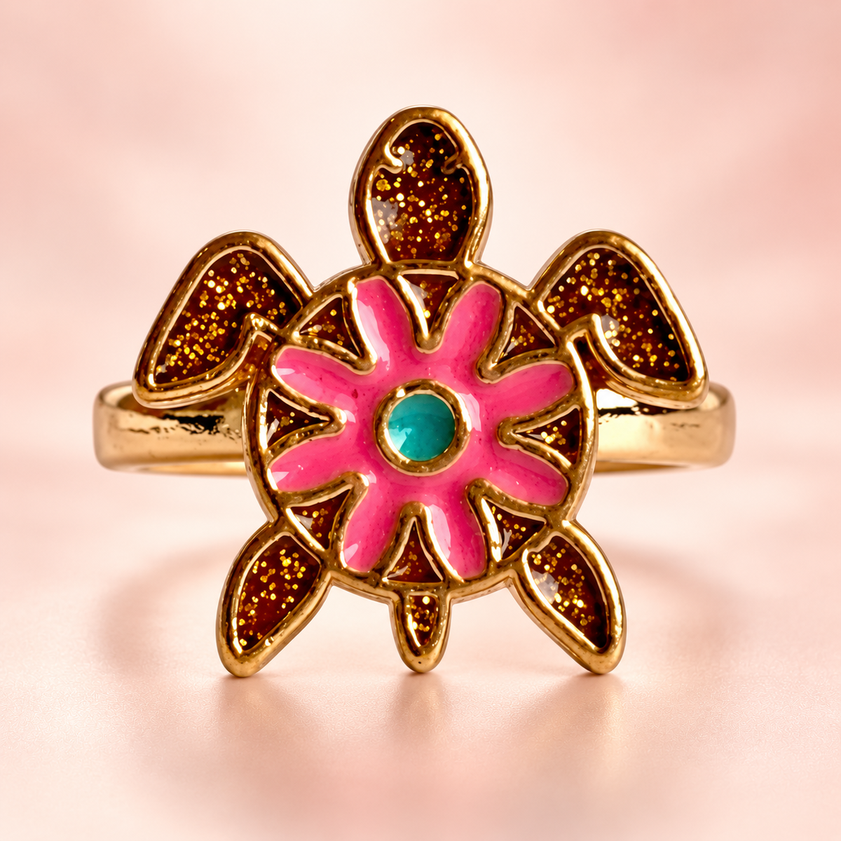 Gold-Tone Turtle Ring on a softly coloured background