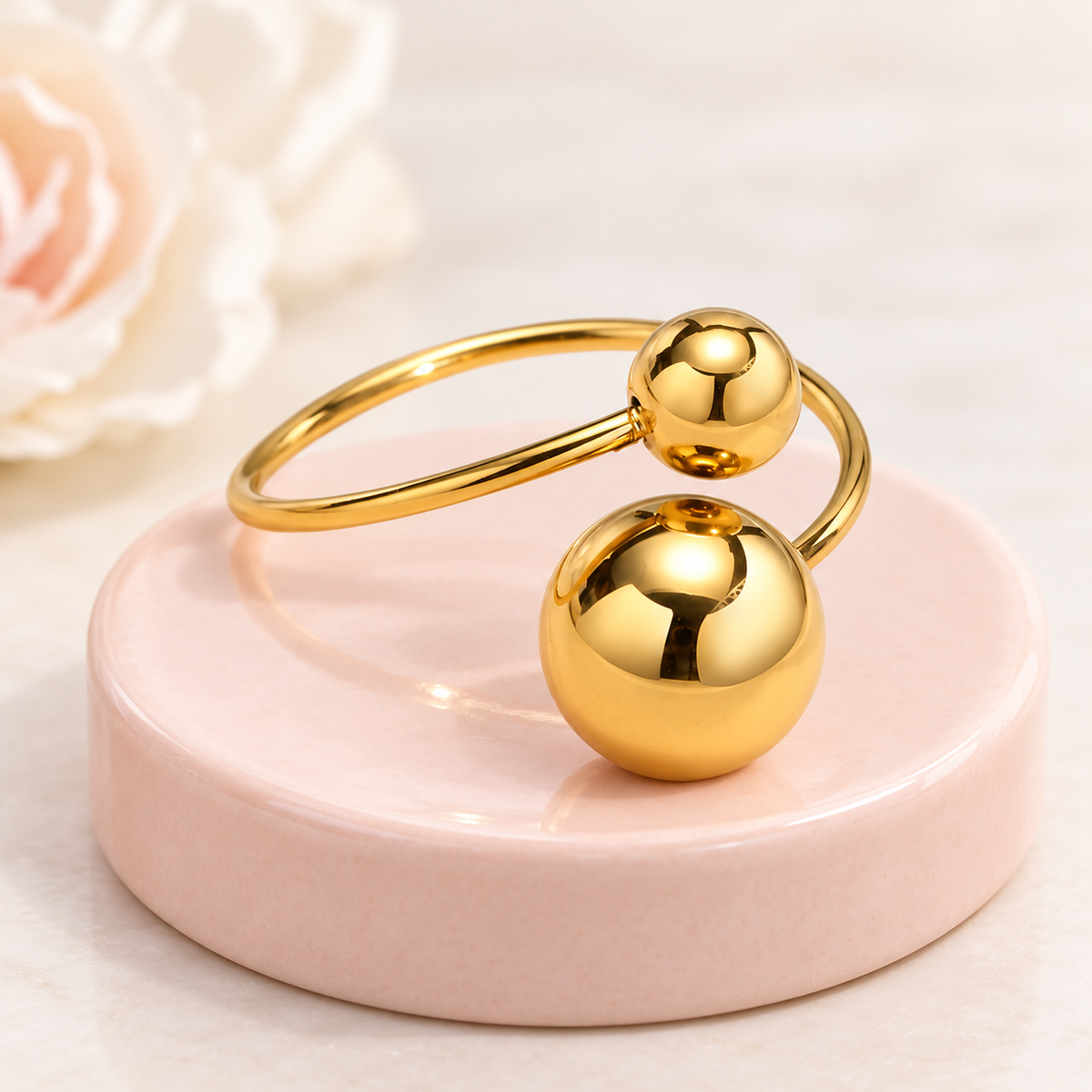Gold-Tone Double-Sphere Open Ring for Women in a styled product photograph