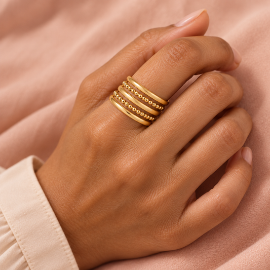 Gold-tone multi-row ring with two beaded rows styled on a hand