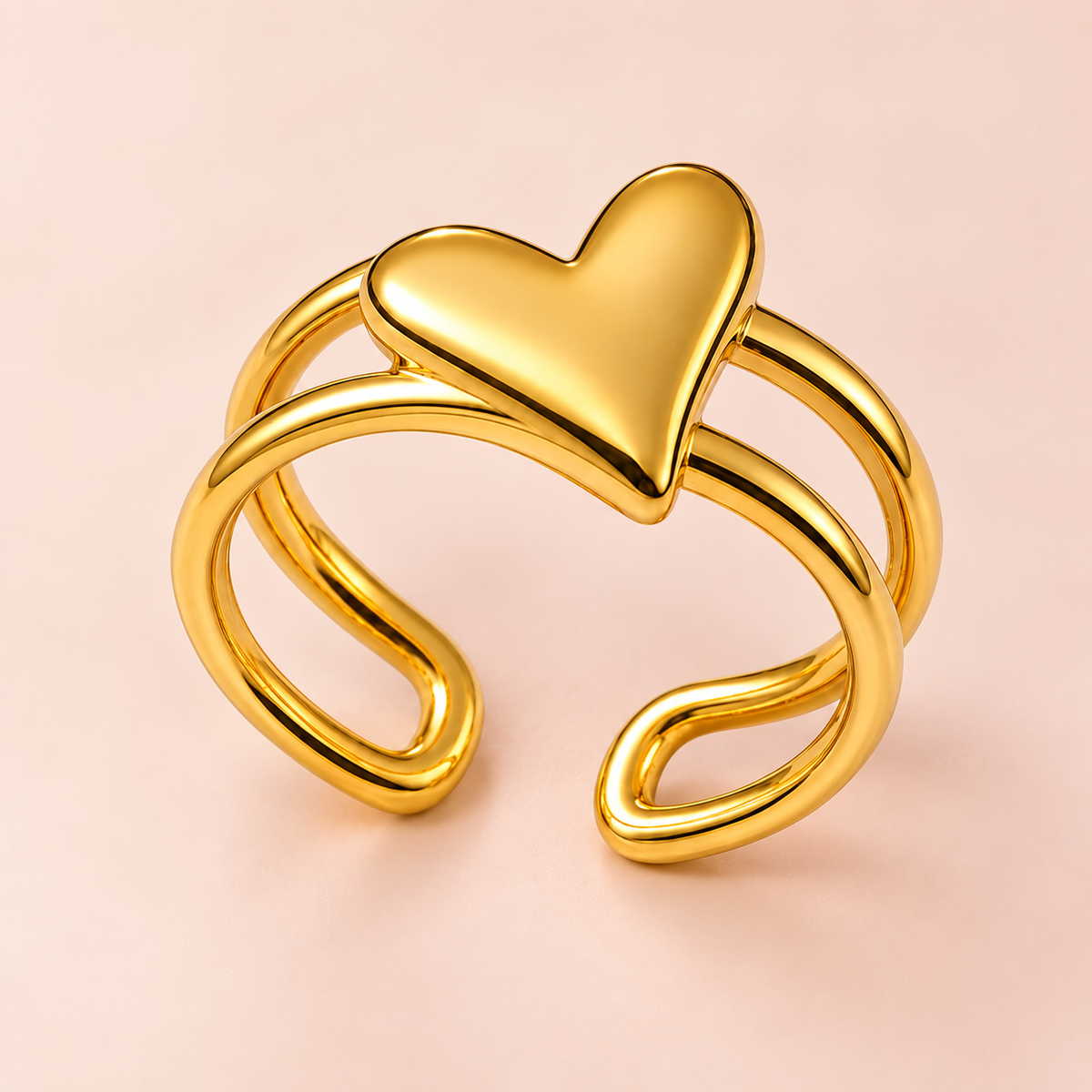 Gold-tone heart ring with an open double-rail band