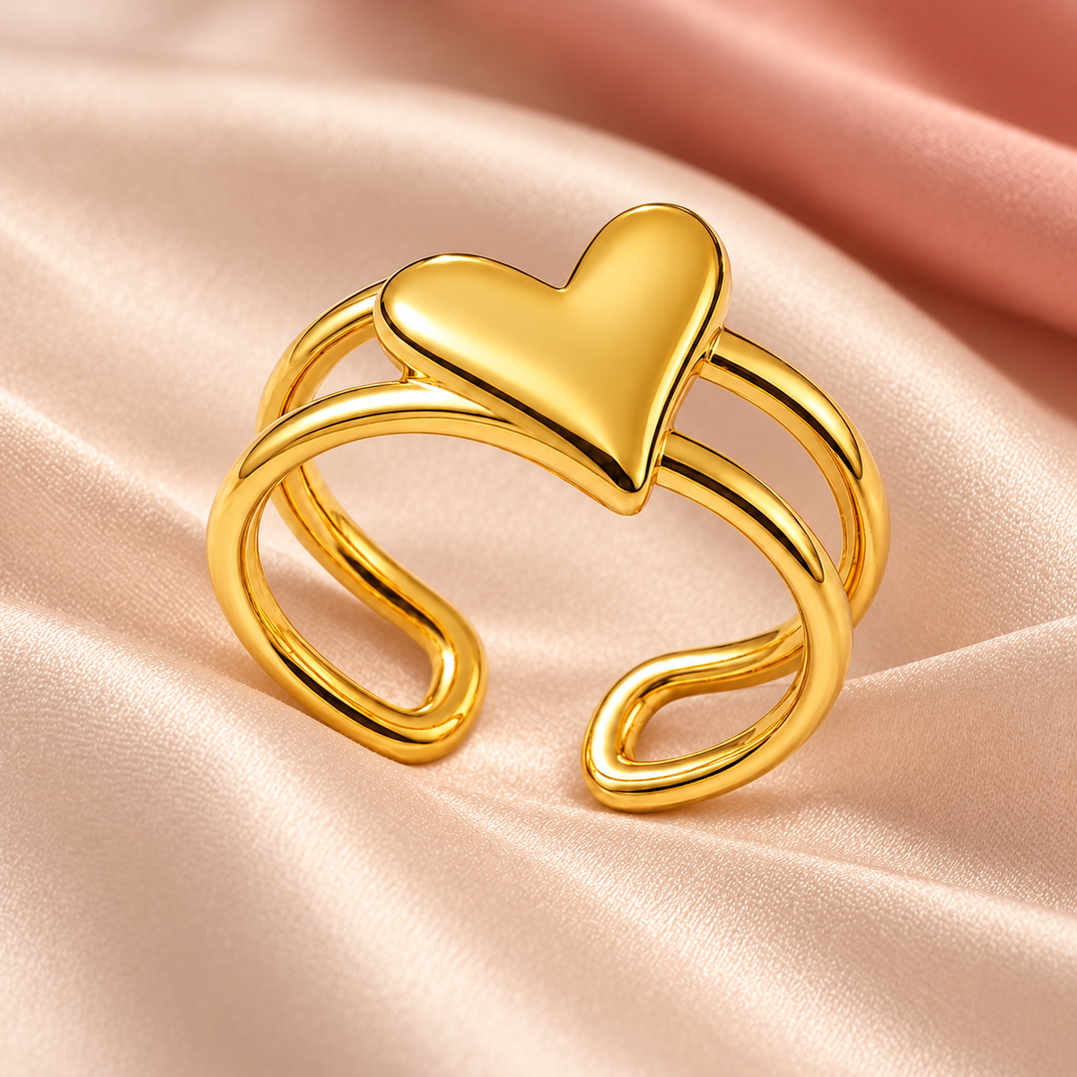 Gold-tone heart ring with an open double-rail band