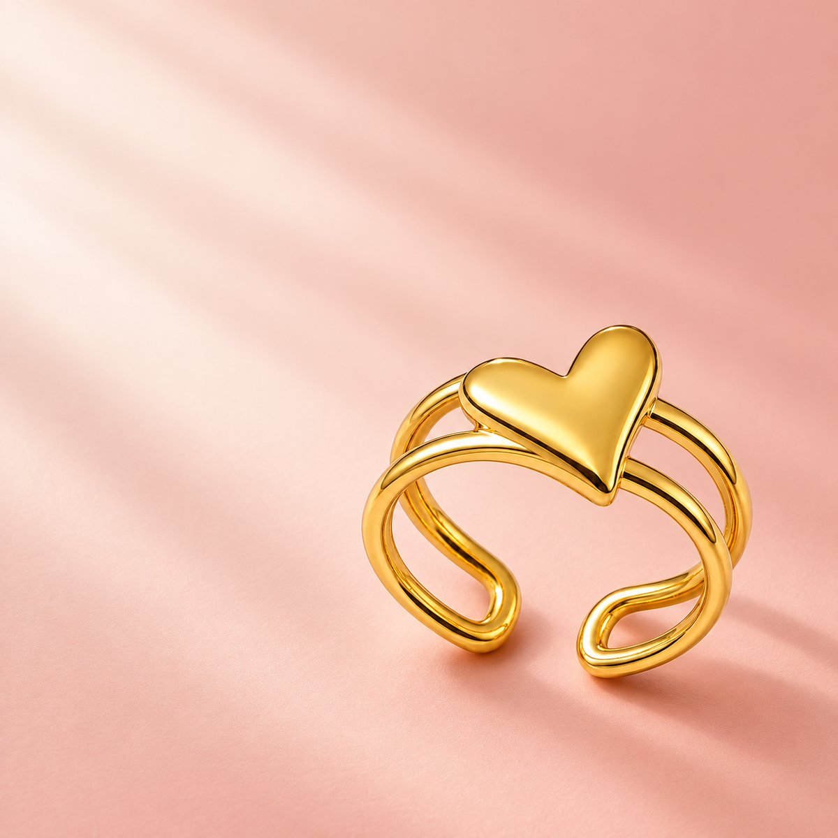 Gold-tone heart ring with an open double-rail band