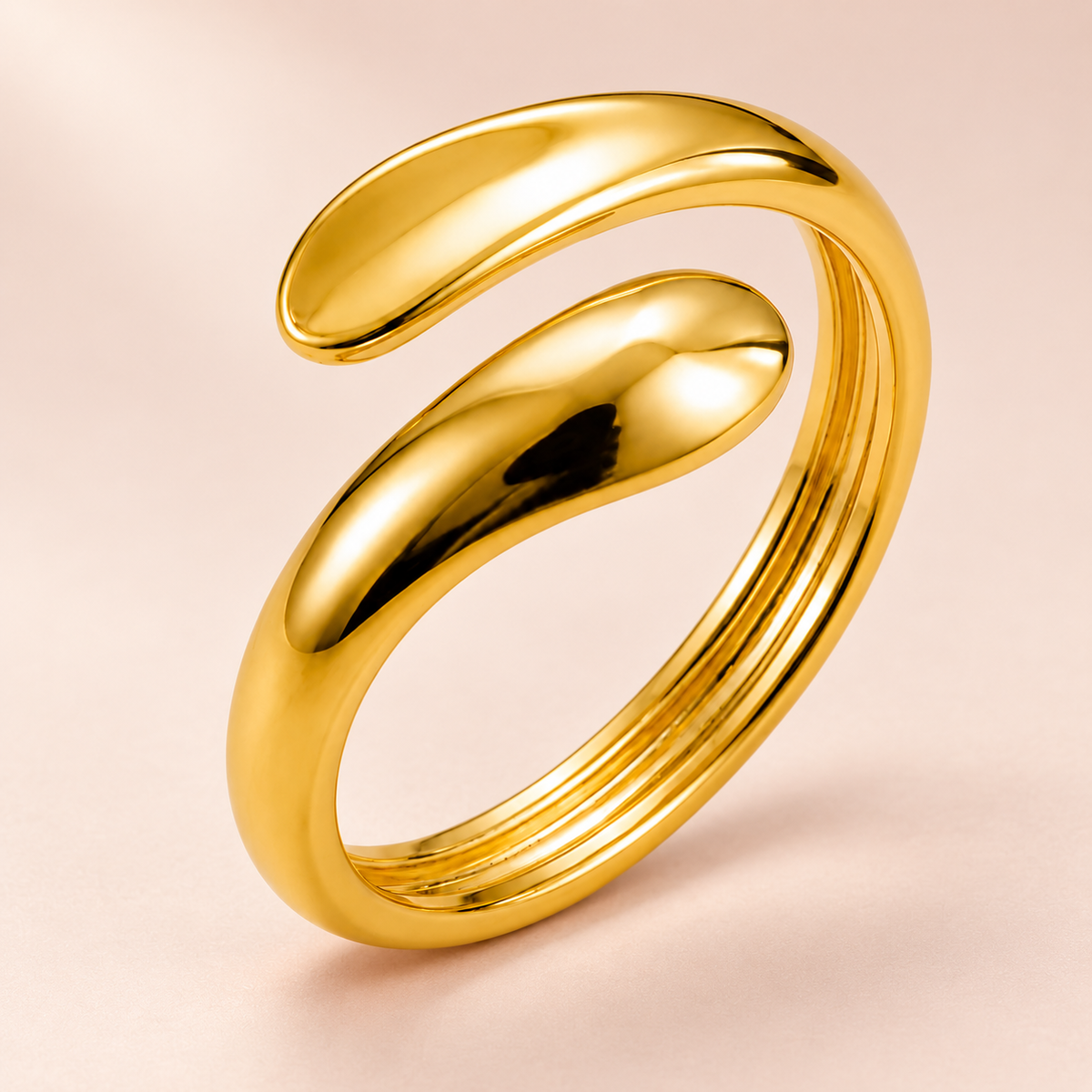 Gold-tone open bypass ring with rounded teardrop ends