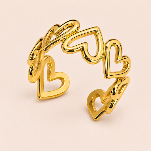 Gold-tone open ring with linked heart outlines