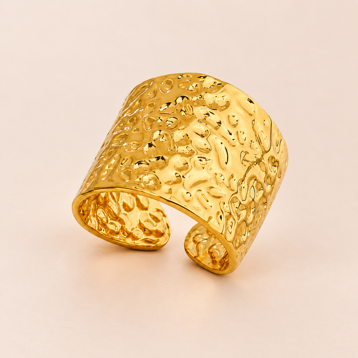 Gold-tone wide open band ring with a hammered texture