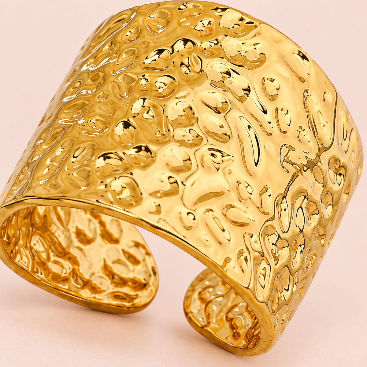 Gold-tone wide open band ring with a hammered texture