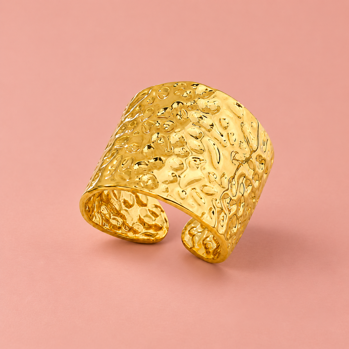 Gold-tone wide open band ring with a hammered texture