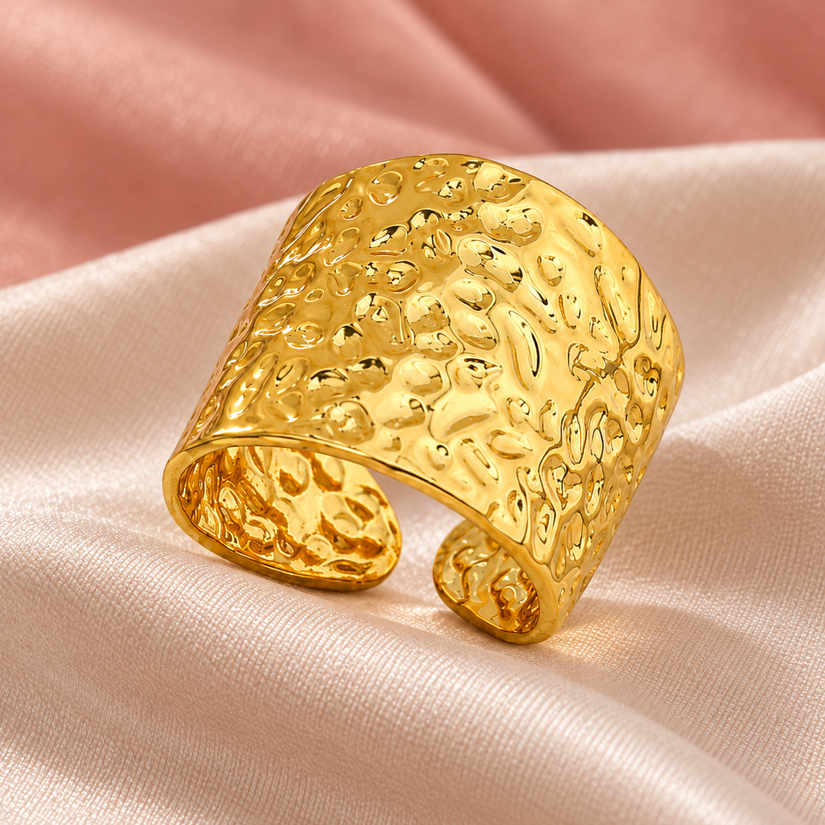 Gold-tone wide open band ring with a hammered texture