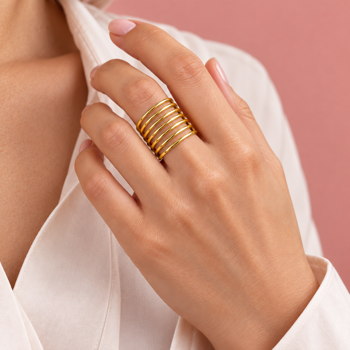 Seven-Rail Open Ring worn on a hand near a white shirt