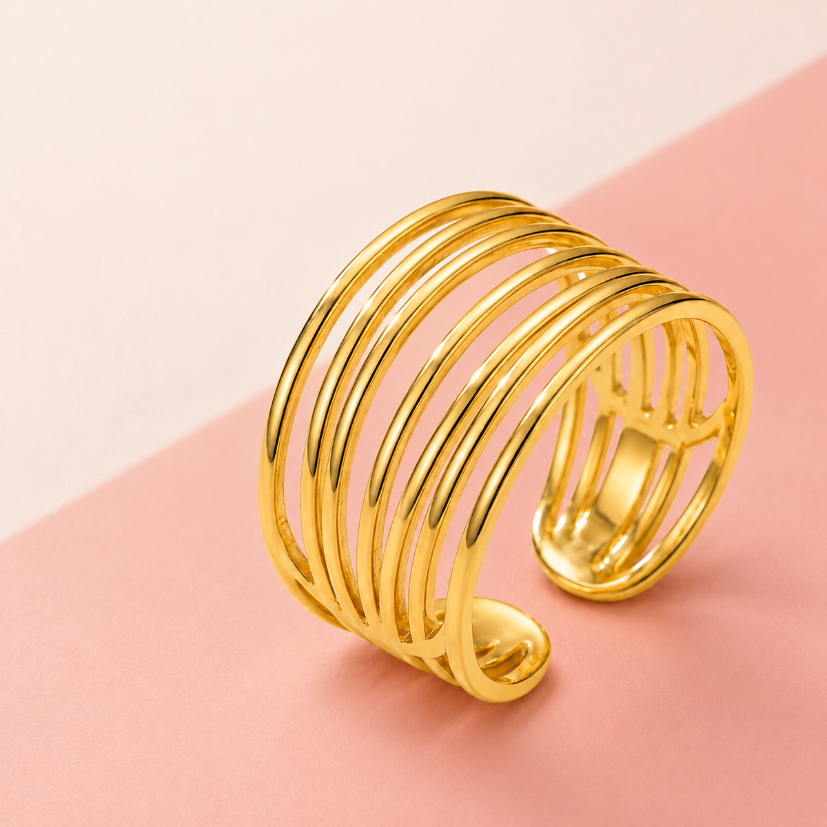 Seven-Rail Open Ring on a pink and cream background